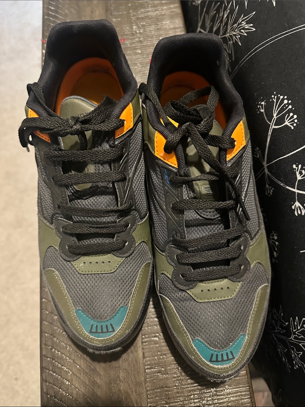 Nike women’s shox Sneakers in Black, Olive & Orange with Teal Accent